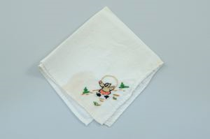 Image of Figure holding small child, one of a set of 3 embroidered napkins with scenes of Inuit girls playing